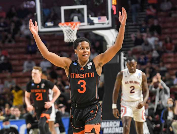University of Miami guard Charlie Moore (3) celebrates after teammate forward Sam Waardenburg (21) dunked against Auburn University during the second half of the NCAA Div. 1 Men's Basketball Tournament preliminary round game at Bon Secours Wellness Arena in Greenville, S.C. Sunday, March 20, 2022. Ncaa Mens Basketball Second Round Miami Vs Auburn Syndication The Greenville News